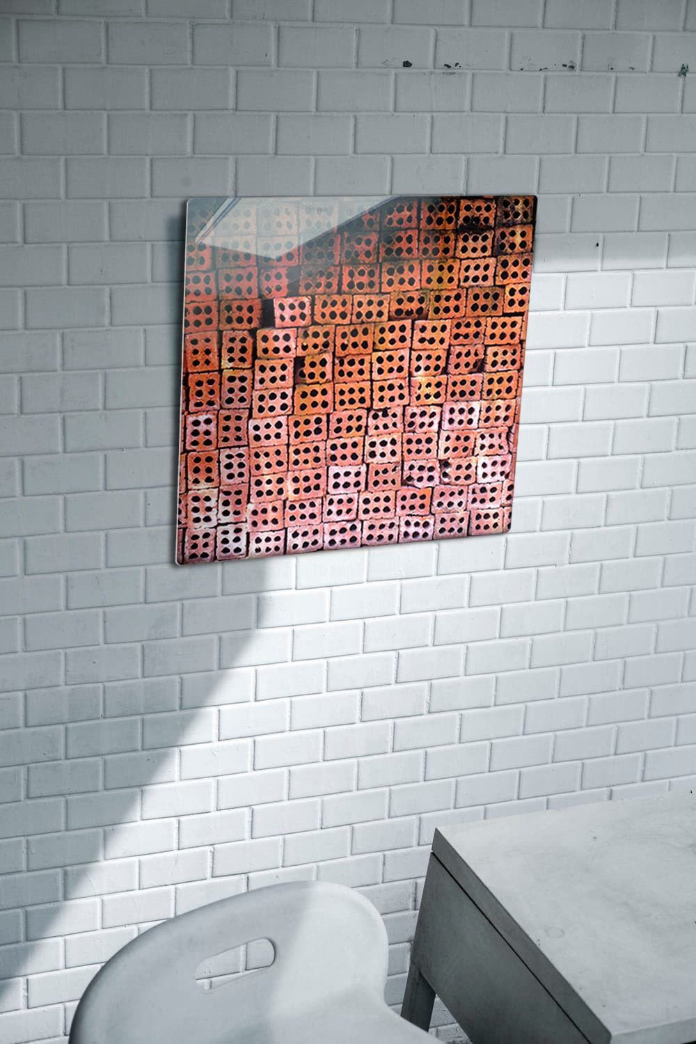 18 inch Patterns of Da Nang metal print on a white tiled wall above a desk and chair